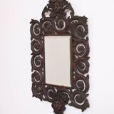 Miroir mural antique en bronze coulé représentant une tête de femme
