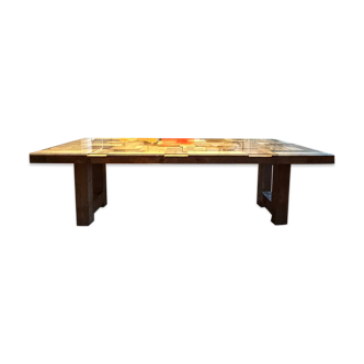 Magnificent wooden table with a glass top.