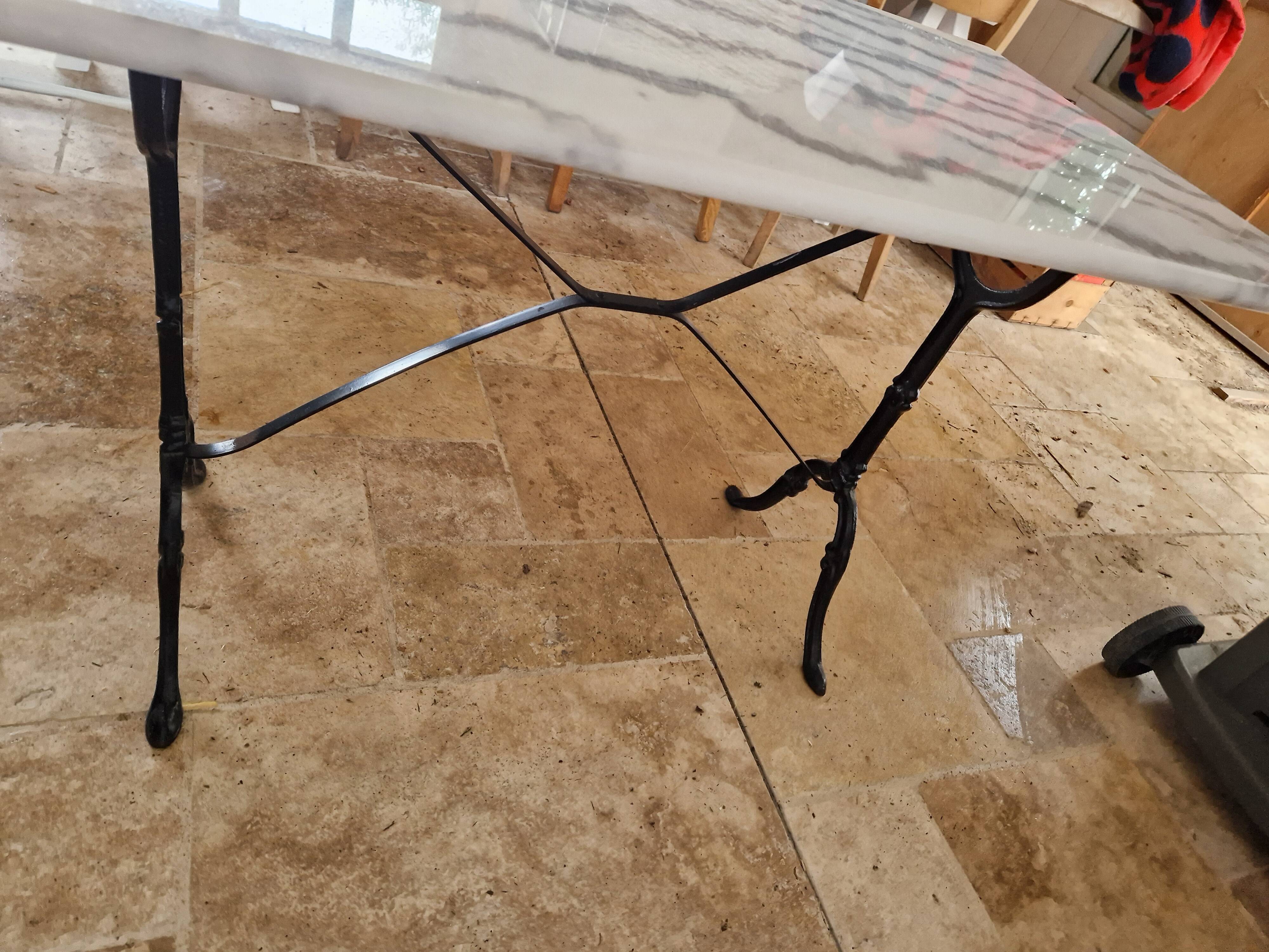 Bistro table with marble top and cast iron legs