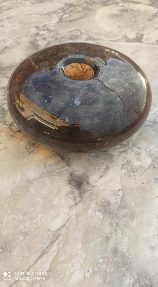 Flattened spherical vase made of glass paste