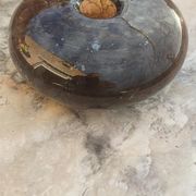 Flattened spherical vase made of glass paste