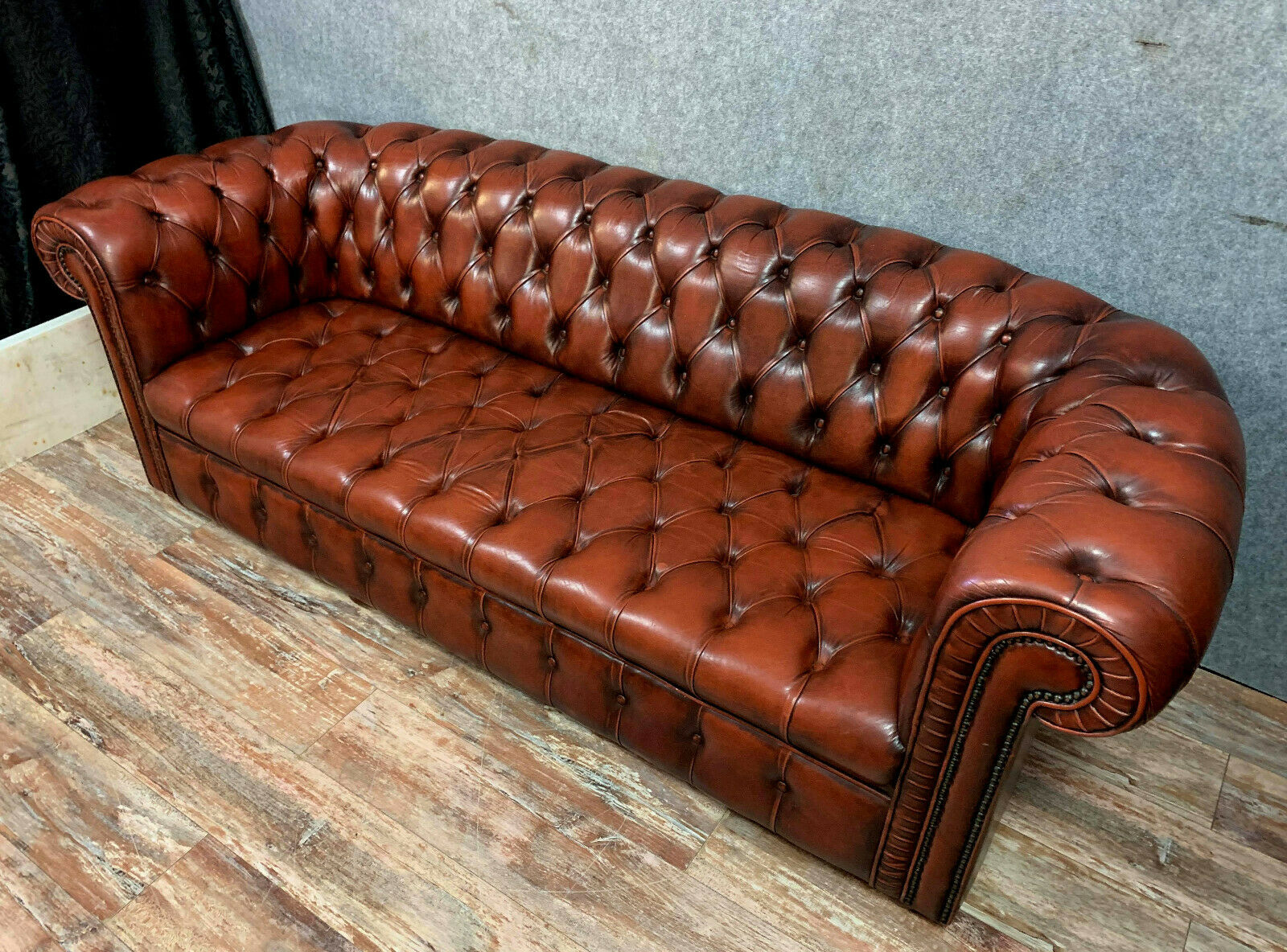 Chesterfield sofa in burgundy upholstered leather circa 1920