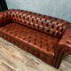 Chesterfield sofa in burgundy upholstered leather circa 1920
