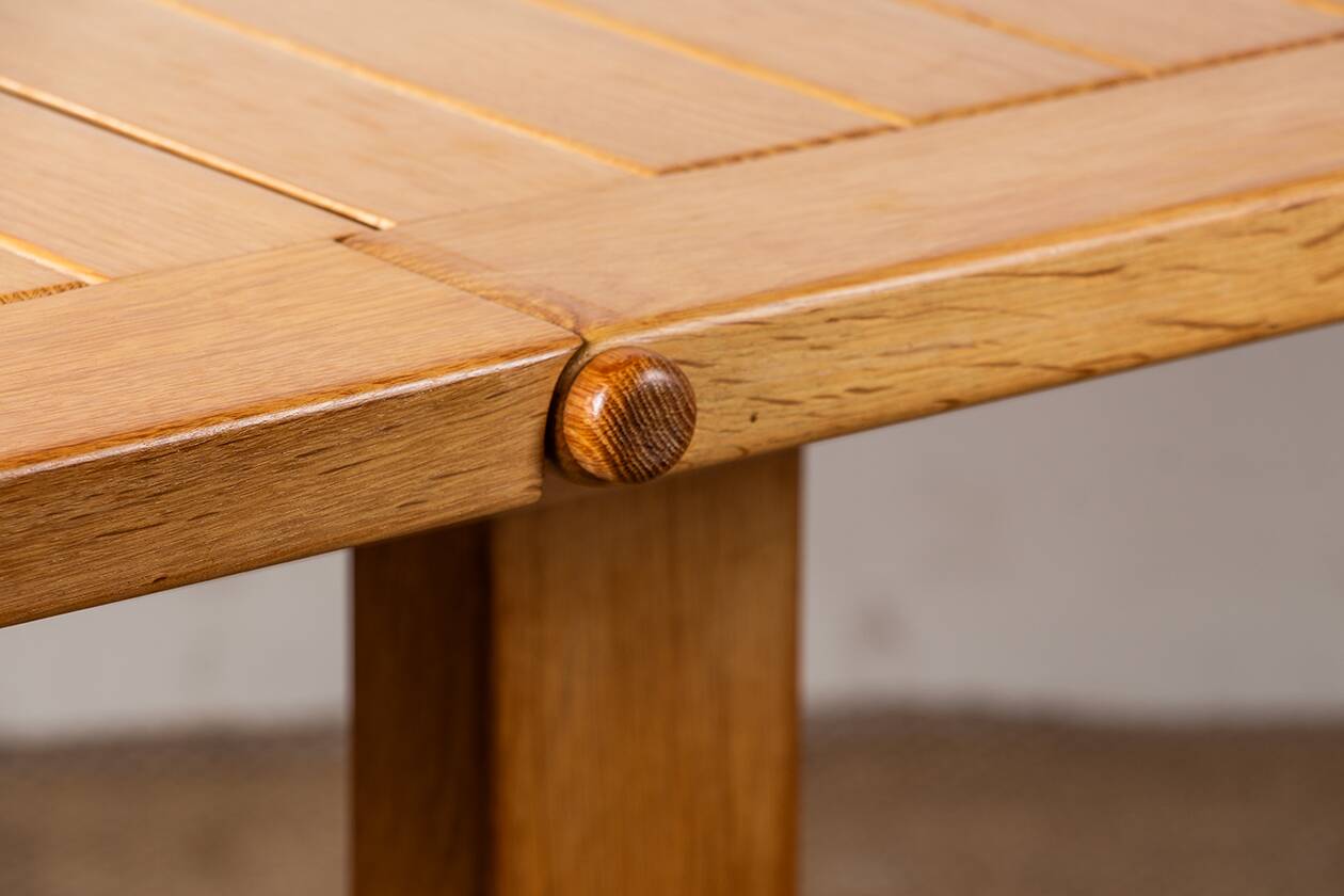 Large extendable dining table in solid oak by Guillerme and Chambron.