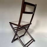Set de quatre chaises pliantes en bois et cannage