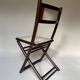 Set de quatre chaises pliantes en bois et cannage