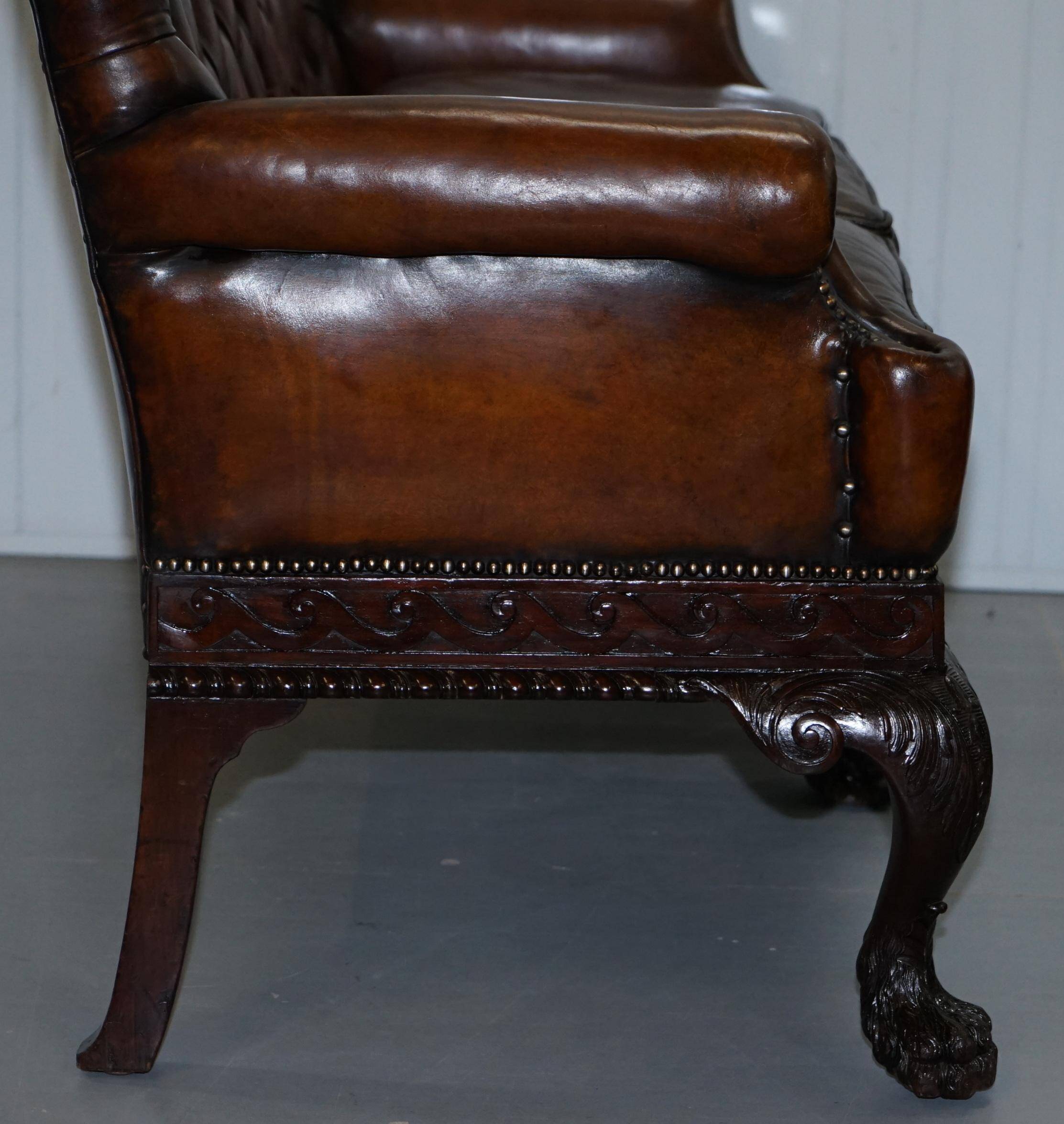 Chesterfield leather canapé in Georgian style with lion paw carved feet.