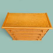 Dresser and its bedside table in rattan caning and vintage oak from the 1970s.