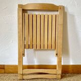 Folding chairs designed by Aldo Jacober in solid beech wood.