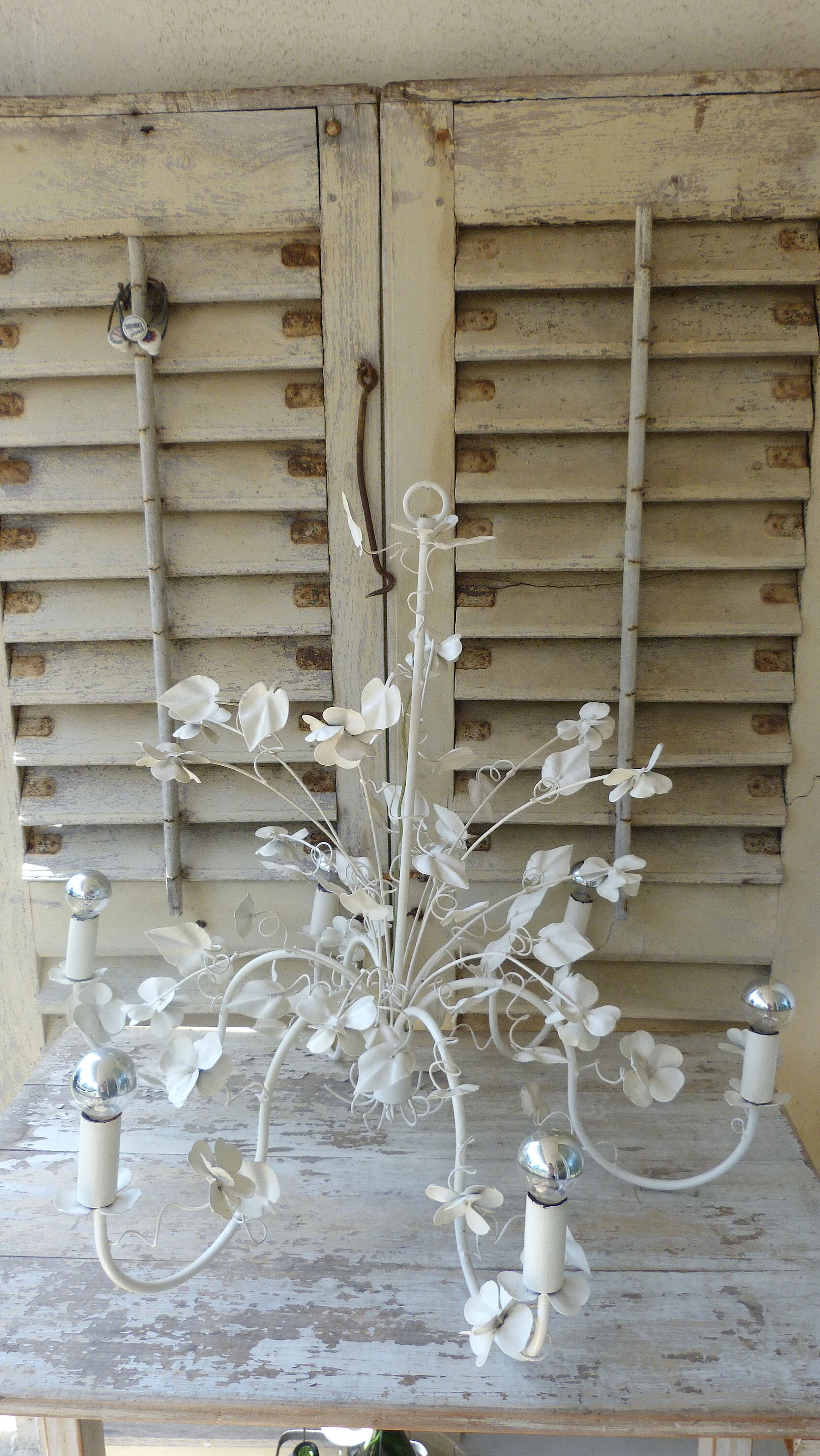 Vintage chandelier in painted metal decoration foliage and flowers