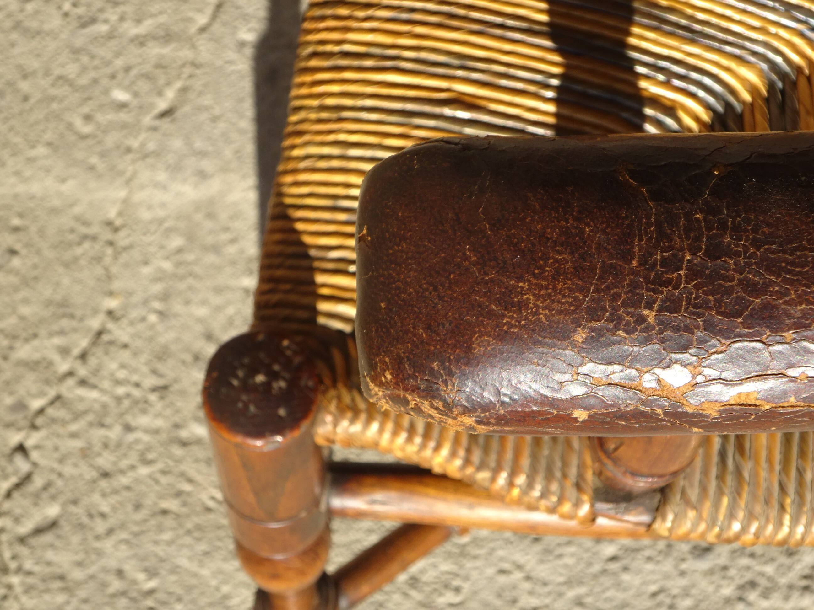 old armchair with leather armrests, from the 19th century