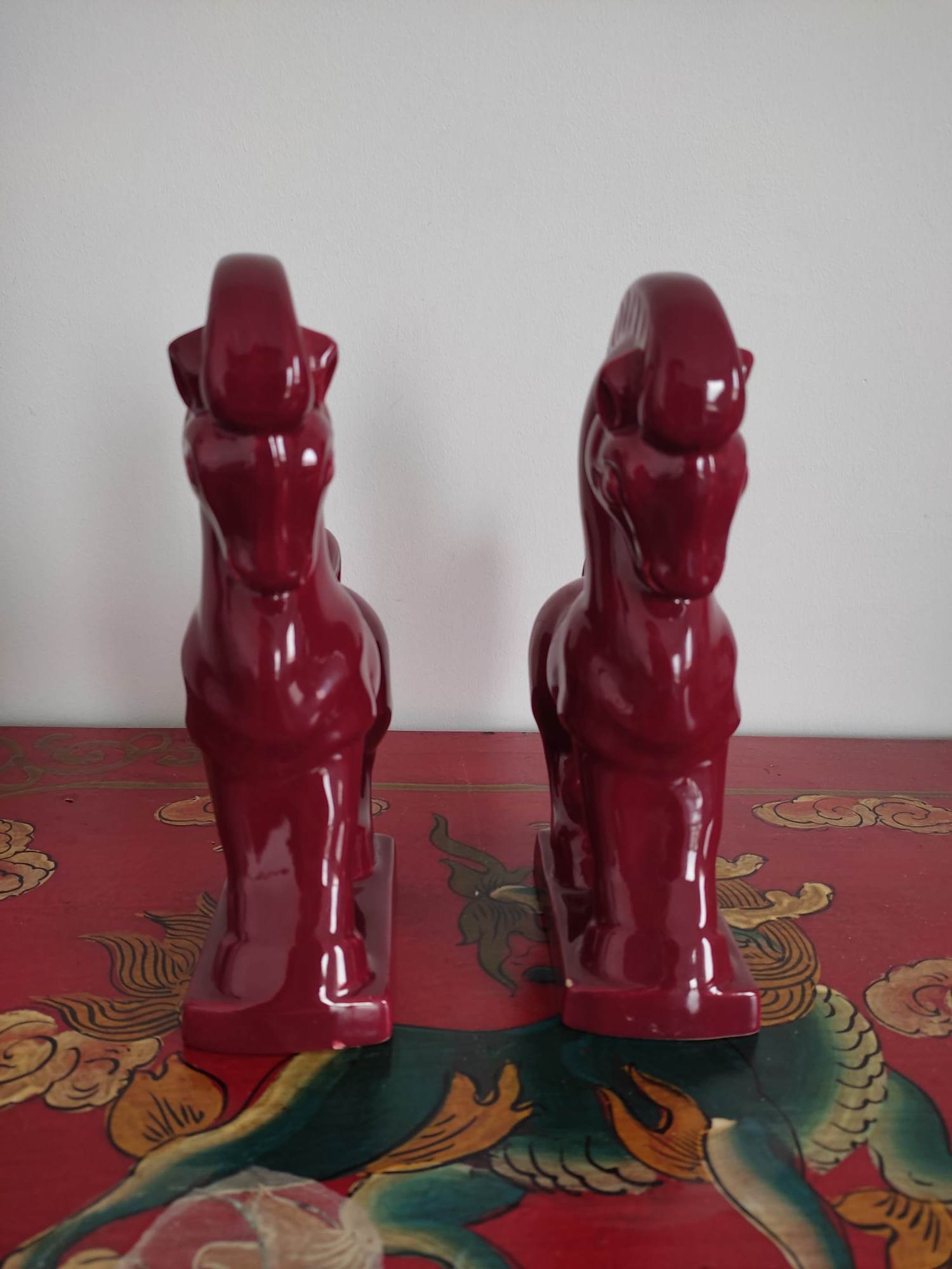 Pair of red porcelain horse bookends