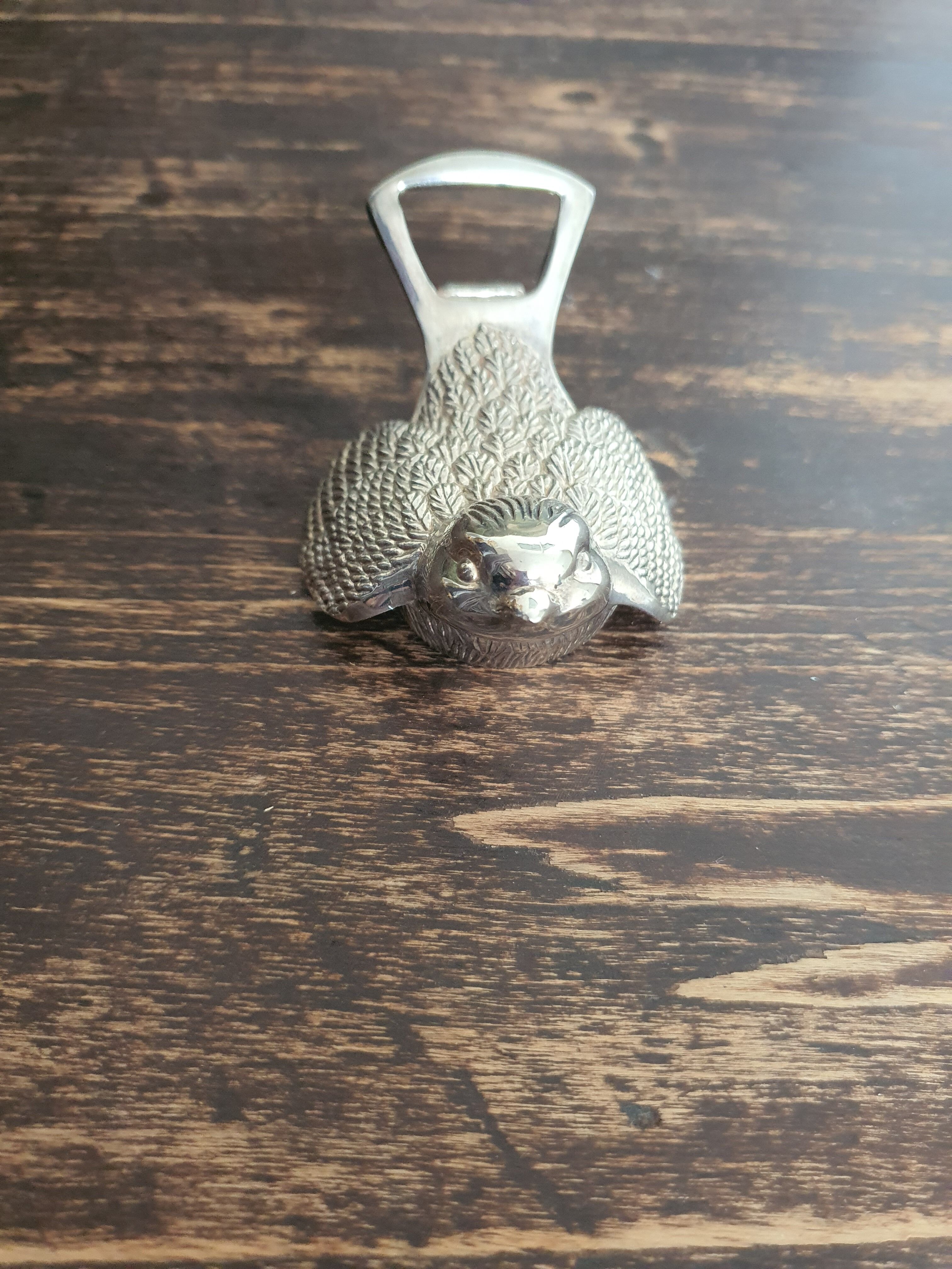 Bird bottle opener in vintage silver metal