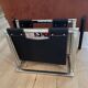 Chrome metal and leather magazine rack