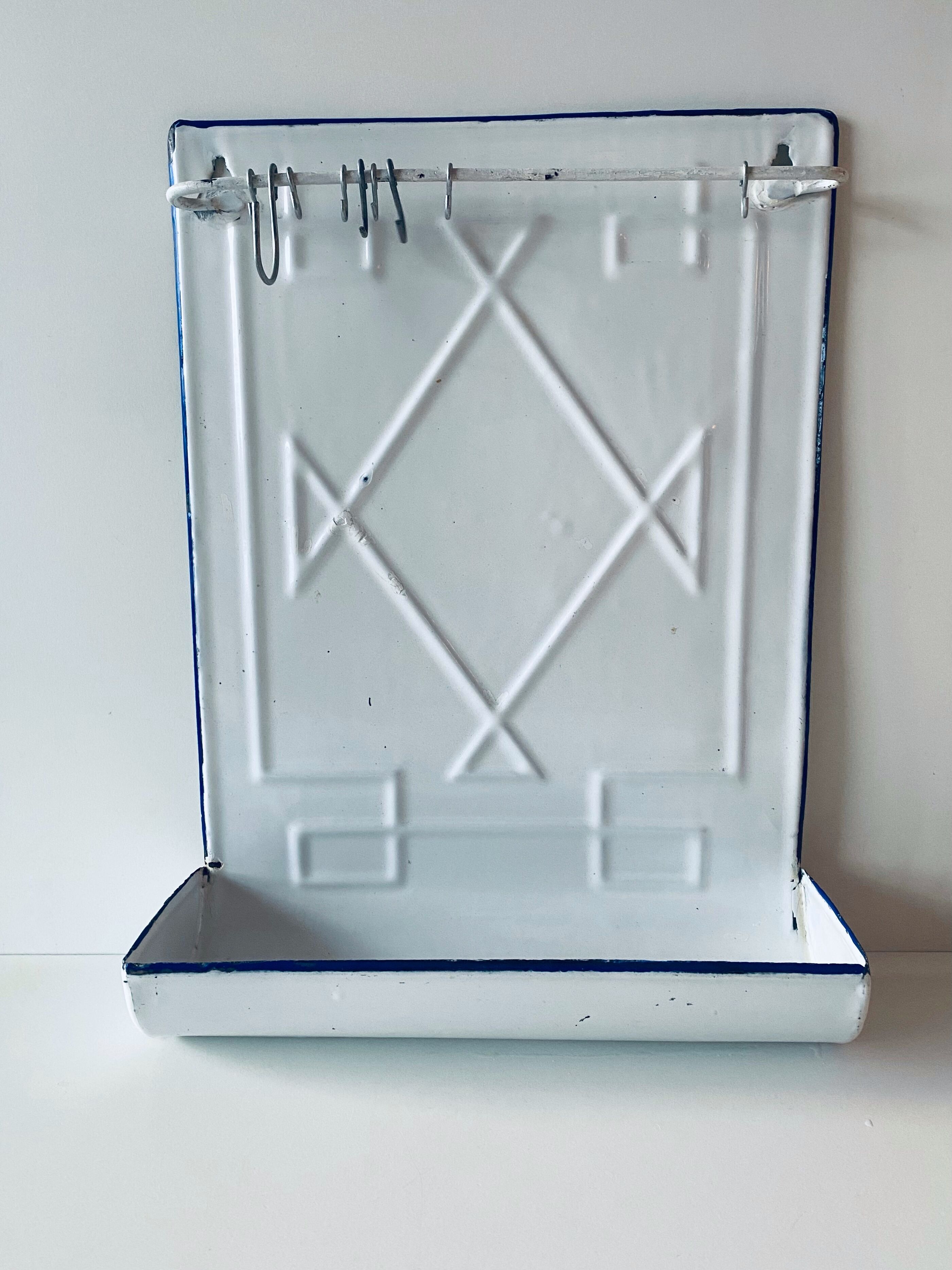 Old enamelled kitchen utensil display