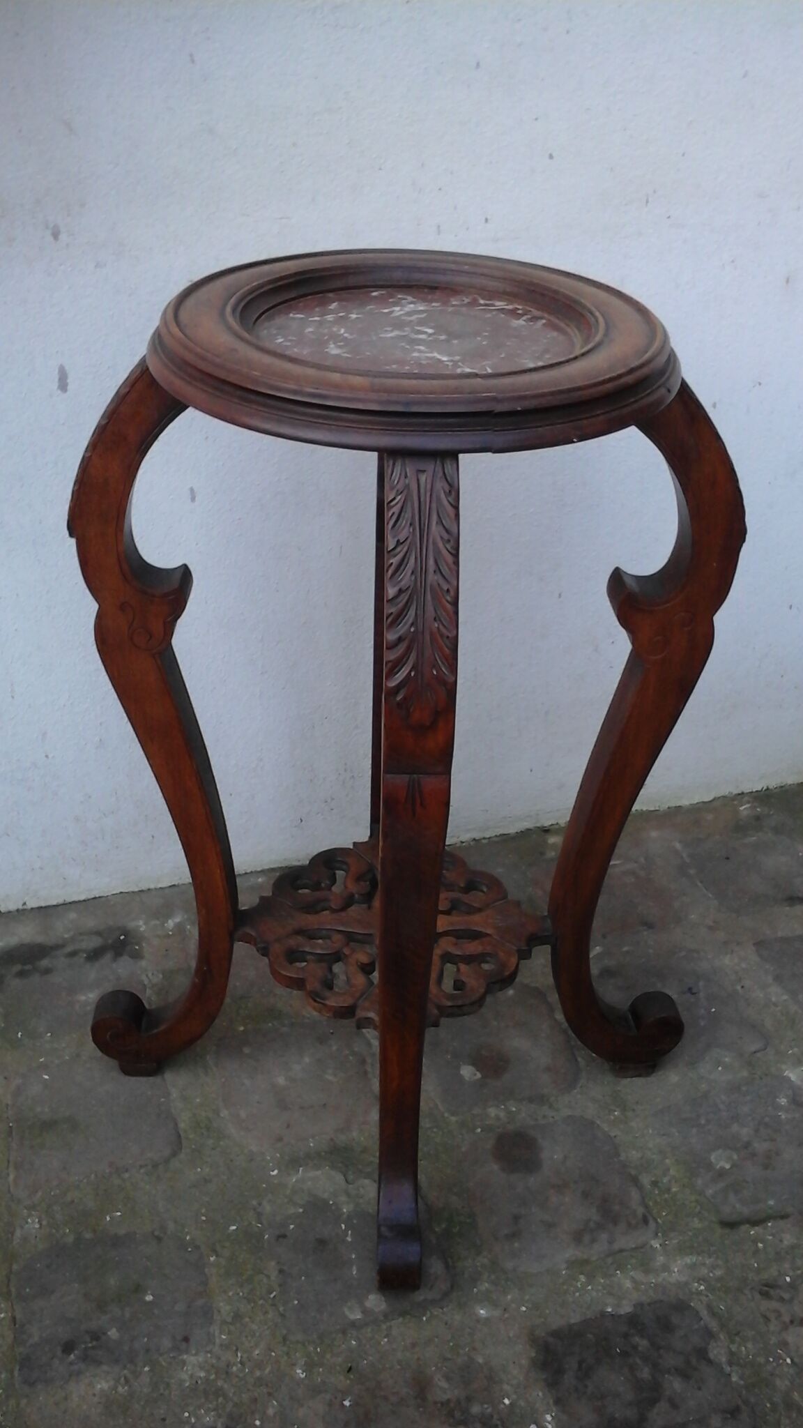 Wooden pedestal table with marble top