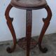 Wooden pedestal table with marble top