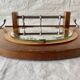 Art Deco wooden wall coat rack with round central mirror