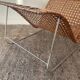 Magazine holder in woven rattan and metal