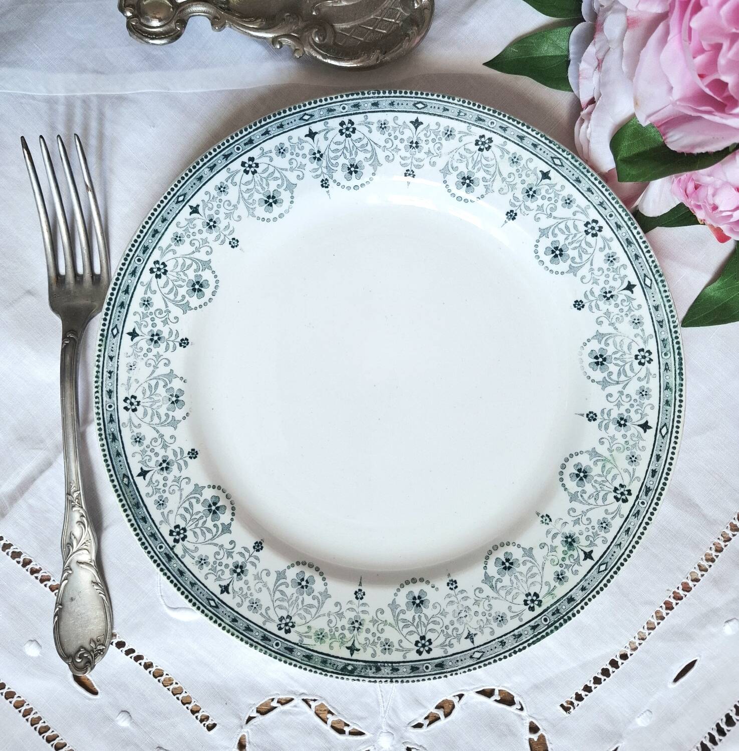 Mismatched antique flat plates made of ironstone accompanied by