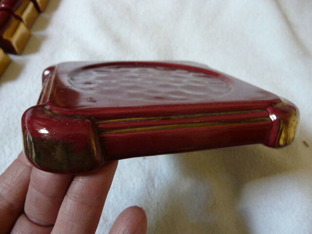 together 12 carries knives and a red enamelled earthenware bottle
