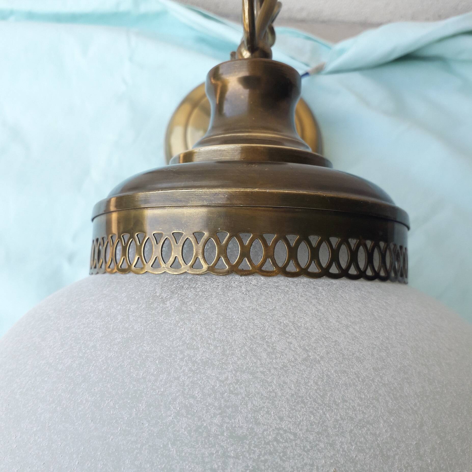 Glass and brass suspension