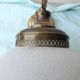 Glass and brass suspension