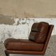 2 armchairs and 1 ottoman in brushed aluminium and brown leather, France, 1970.
