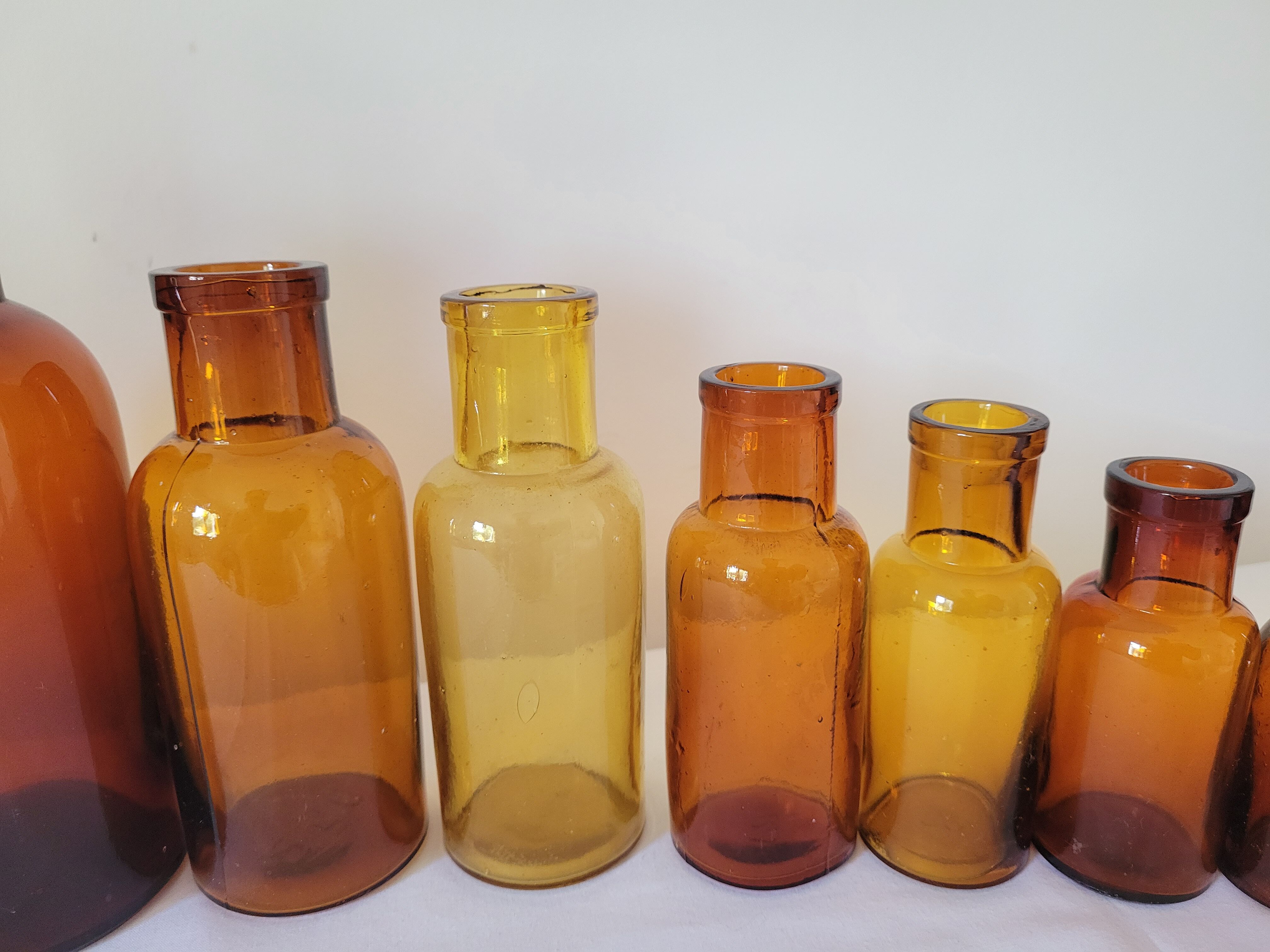 11 bottles of amber glass apothecary