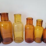 11 bottles of amber glass apothecary