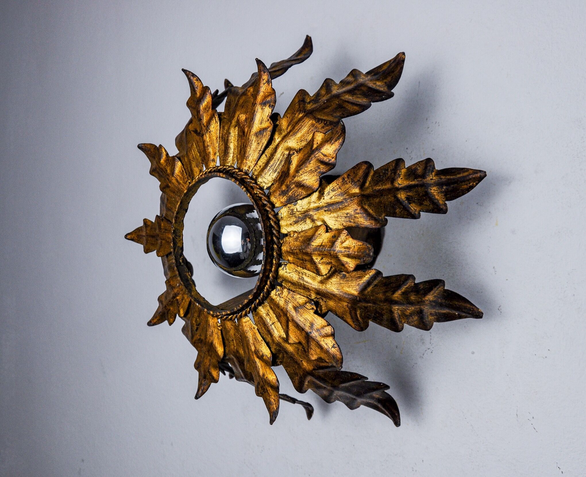 Sun wall lamp by ferro arte, metal and gold leaf, Spain, 1960