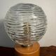 Cylindrical base lamp in solid wood and chiseled glass globe