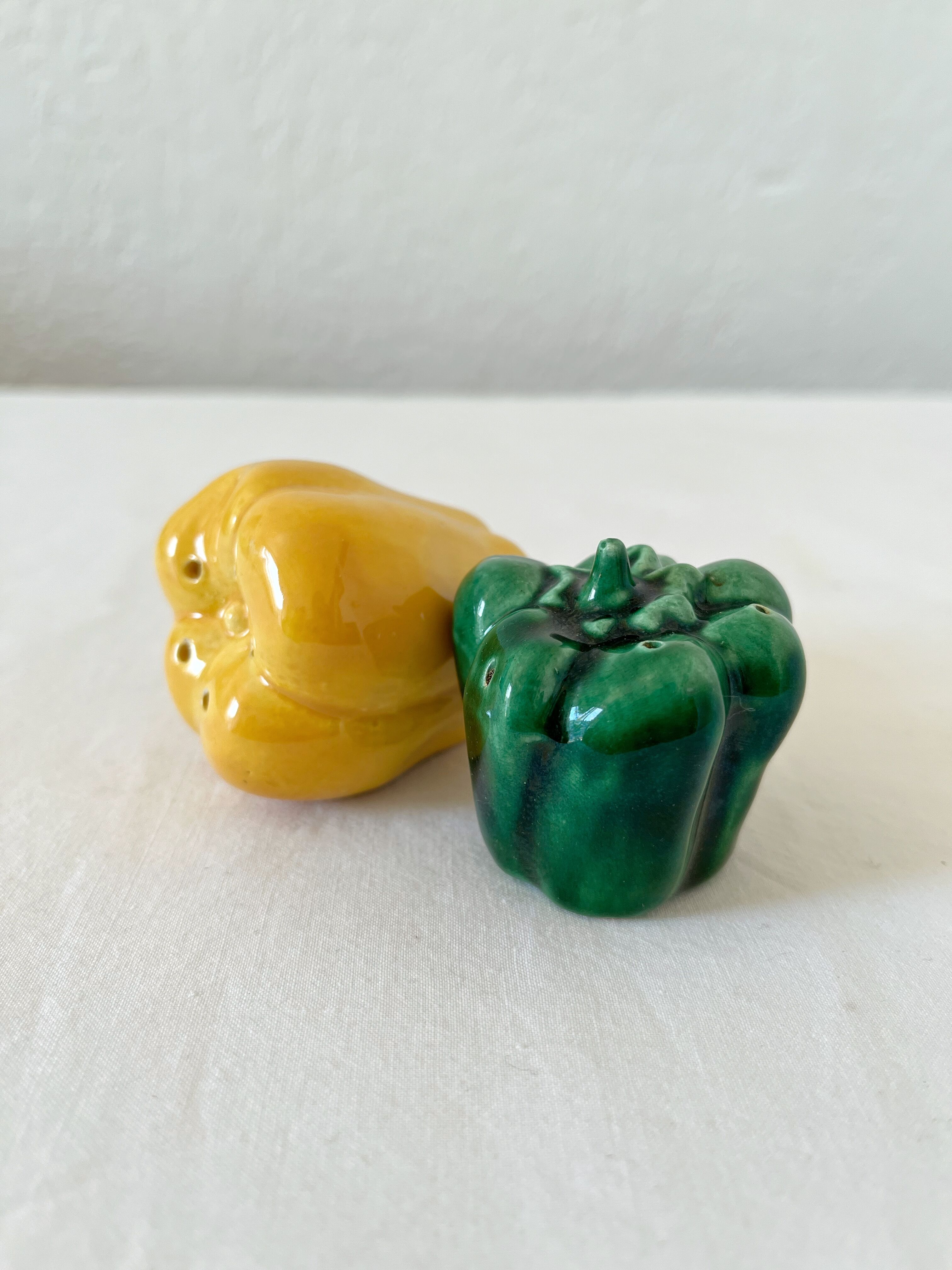 Salt shaker and pepper shaker in vintage slip