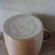 Vase terracotta milk jug with a glazed interior handle.