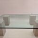 Glass table and travertine feet