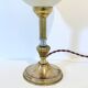 Ostrich egg lamp on a brass stand, antique curiosity cabinet.