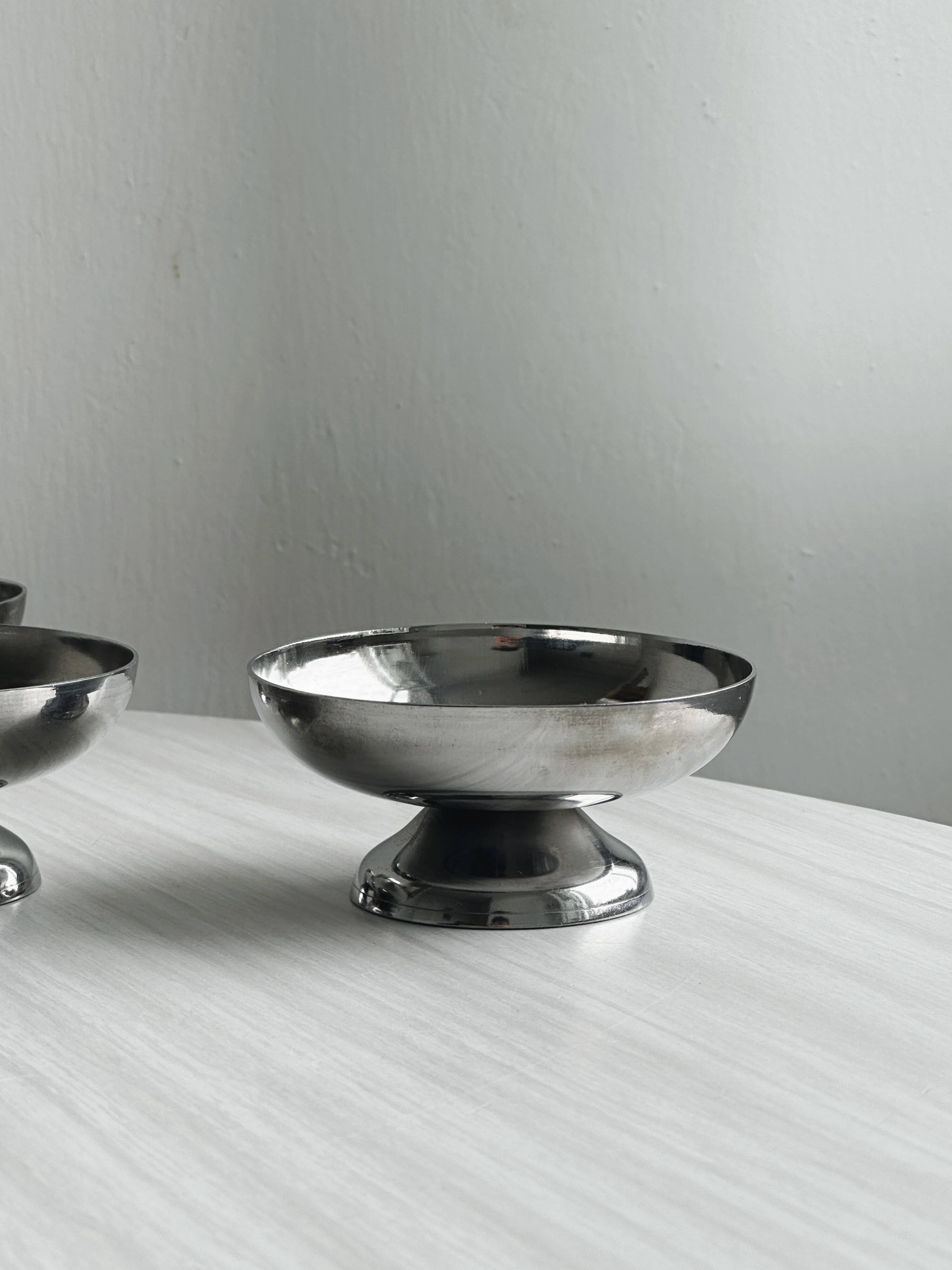 6 stainless steel dessert cups.