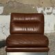 2 armchairs and 1 ottoman in brushed aluminium and brown leather, France, 1970.