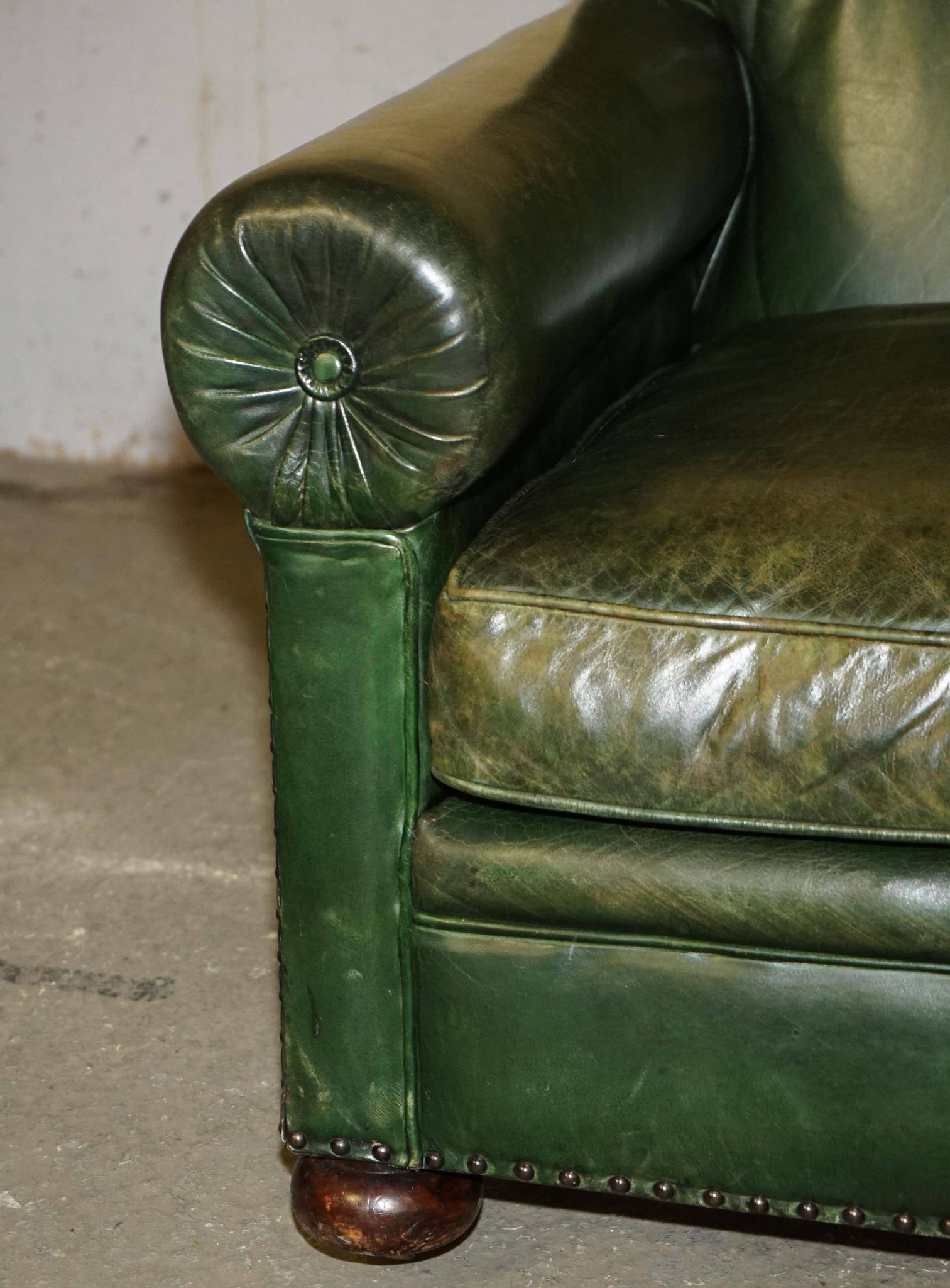 Victorian leather canapé, shield armrests, stamped Maple & Co.
