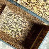 Trunk, black wooden chest and wallpaper