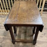 Wooden table with gateleg flaps