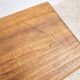 Tabouret ancien en bois foncé patiné
