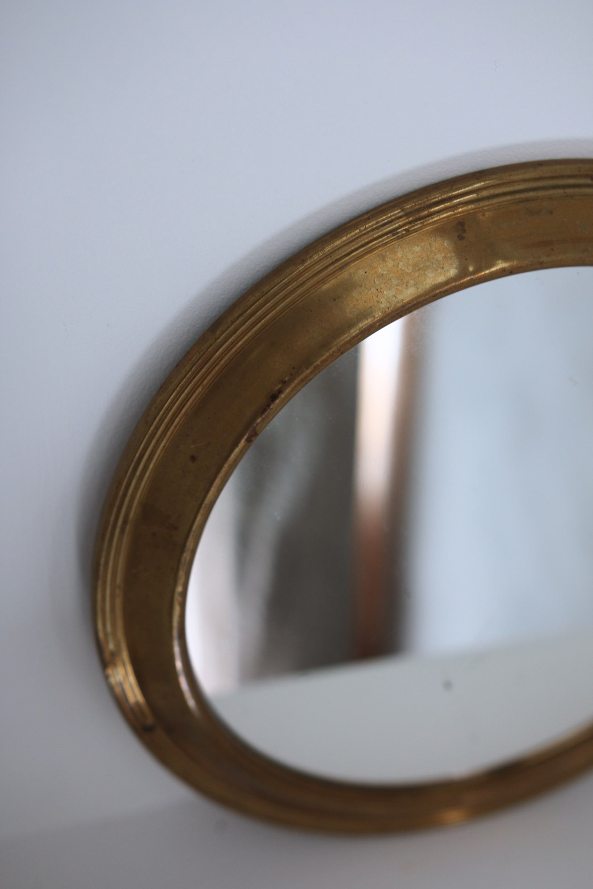 Antique round brass mirror