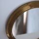 Antique round brass mirror
