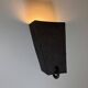 Graphical black stoneware ceramic wall light with handmade ring.