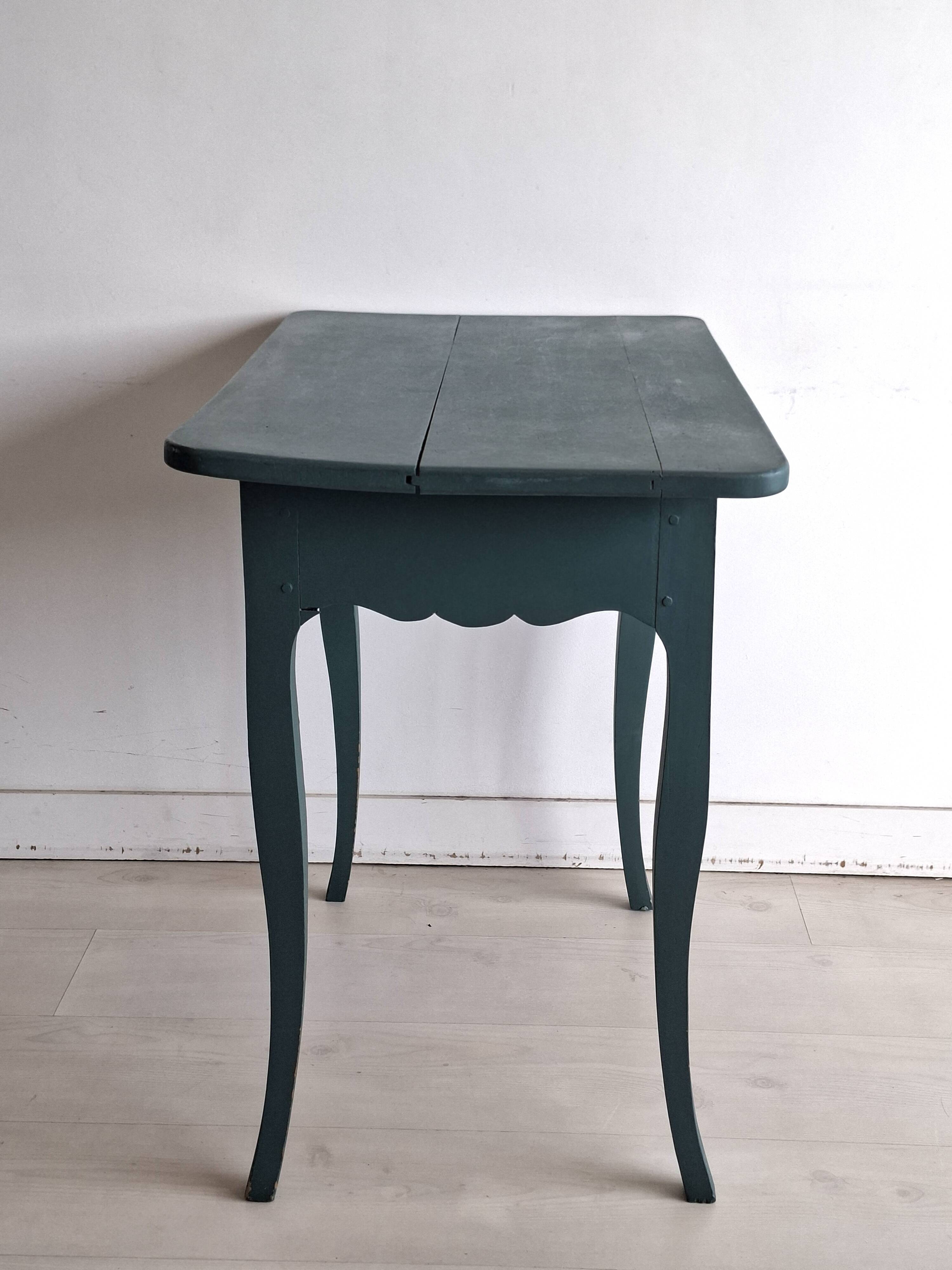 Antique Gustavian-style table painted in dark green with a drawer.