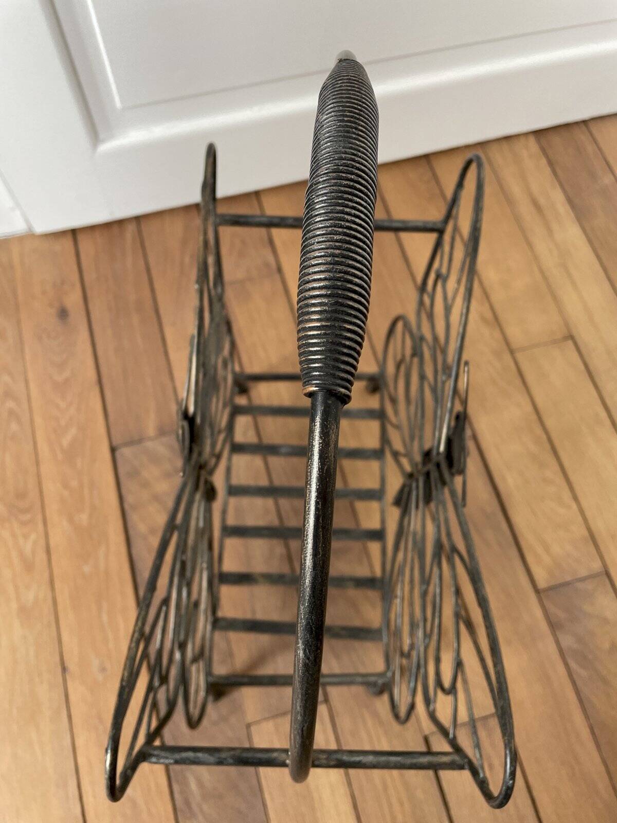 Butterfly magazine rack in patinated metal