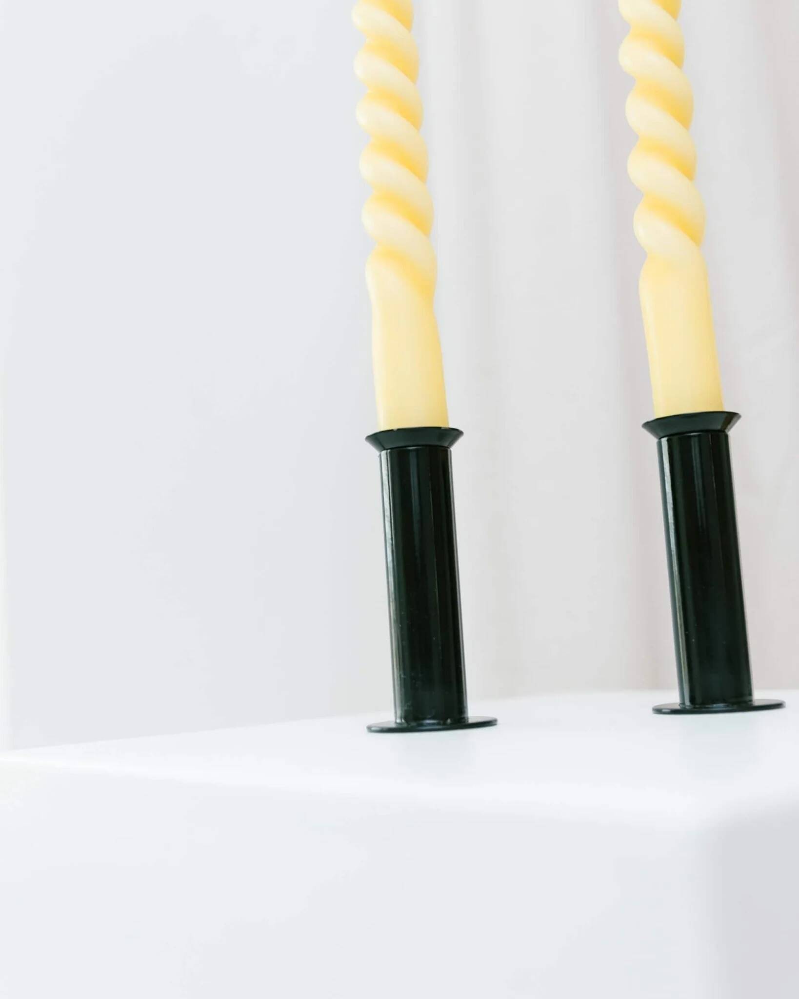 Set of 2 glossy black metal candleholders in retro Ikea Memphis style