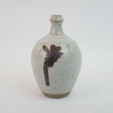 Stoneware bottle with abstract plant motif signed Herbes Folles