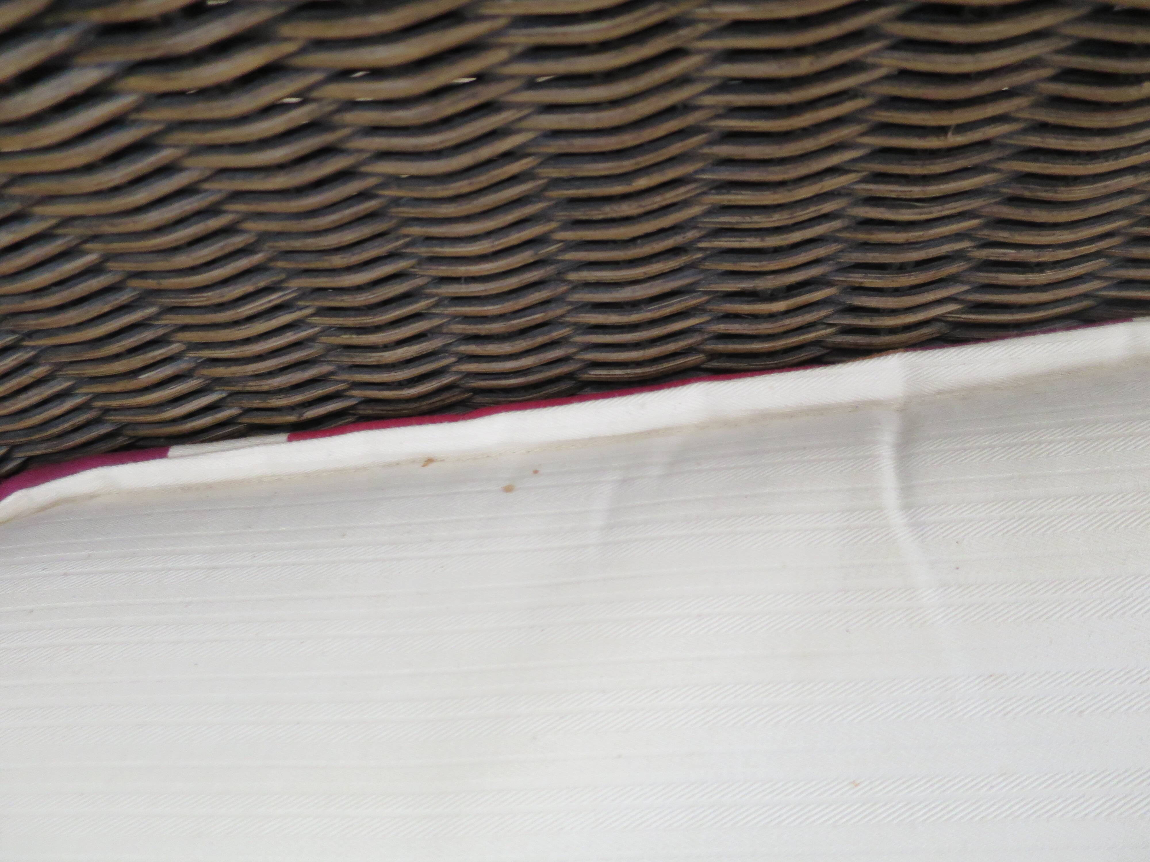 2 armchairs in woven rattan and wood, 1980s